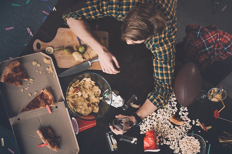 overhead view of young man with lots of food.